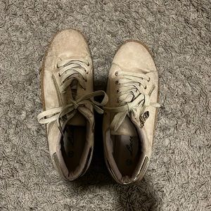 Tan sneakers with zipper on the side